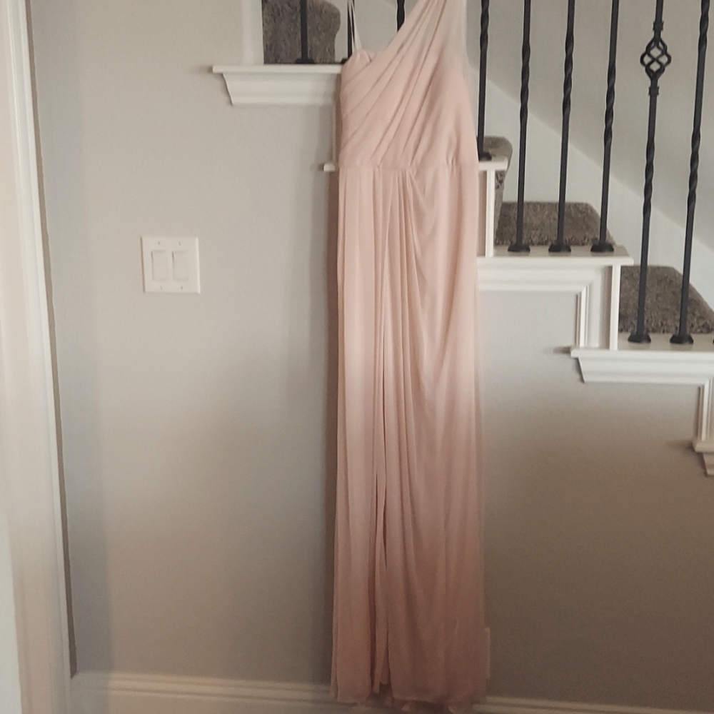 New with tags. Long, flowing David's Bridal light pink gown. Size 4